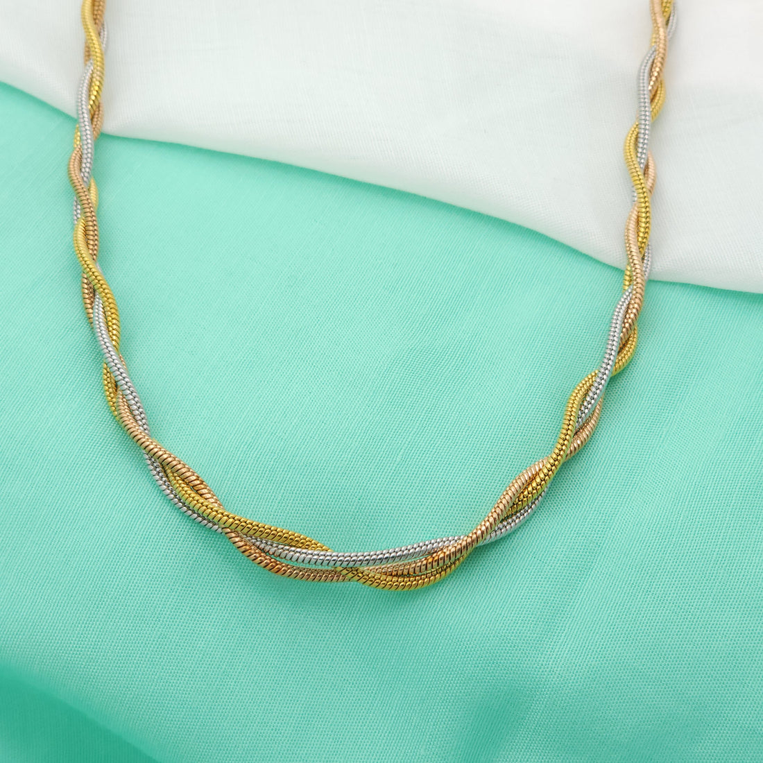 Trio Tangle – Three-Tone Twisted Elegance Chain